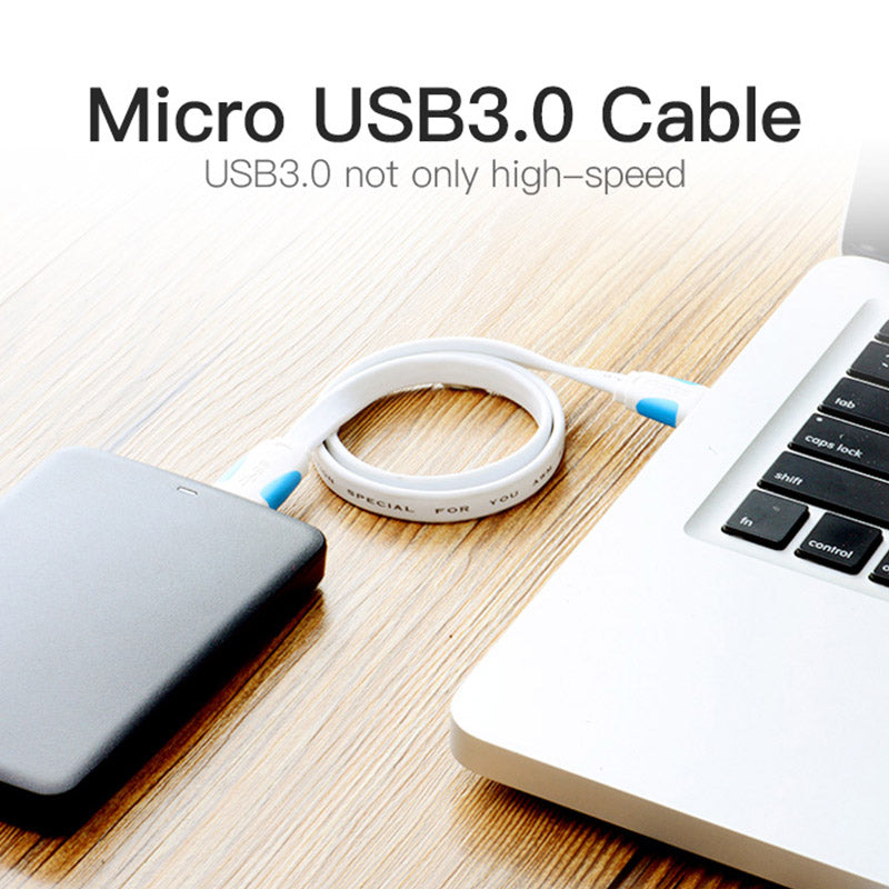 USB 3.0 Micro B cable connecting a portable drive to a laptop for high-speed data transfer
