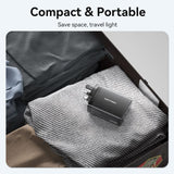 VENTION GaN USB charger 100W in a travel case with folded clothes for compact and portable charging