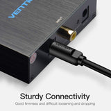 Vention optical fiber audio cable connected to a device showcasing sturdy connectivity features